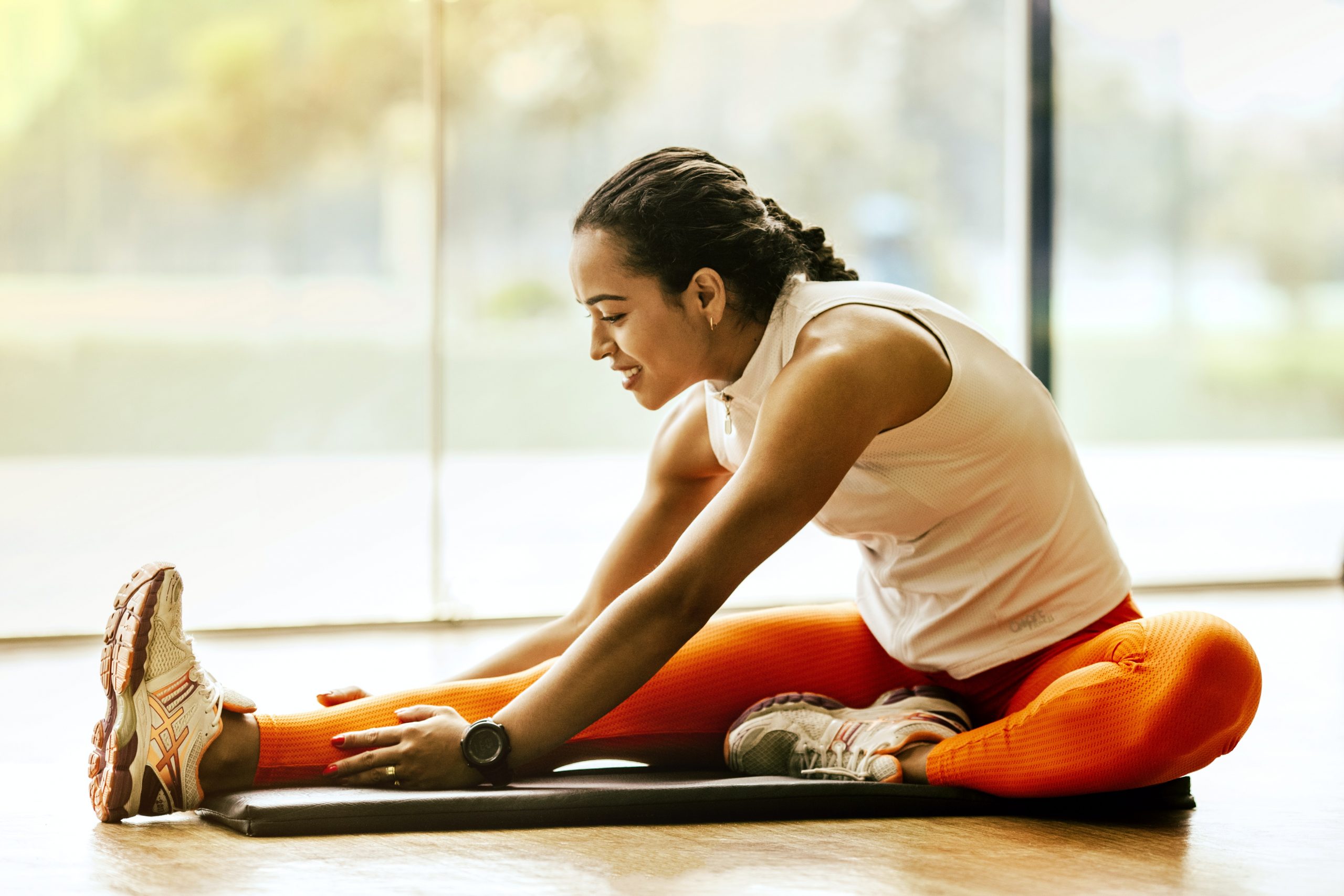 woman stretching on floor